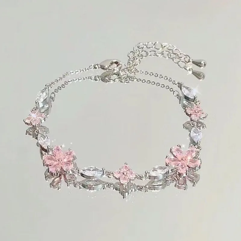 Bransoletka z różowym kryształem i zawieszką kwiat lub księżyc Flower