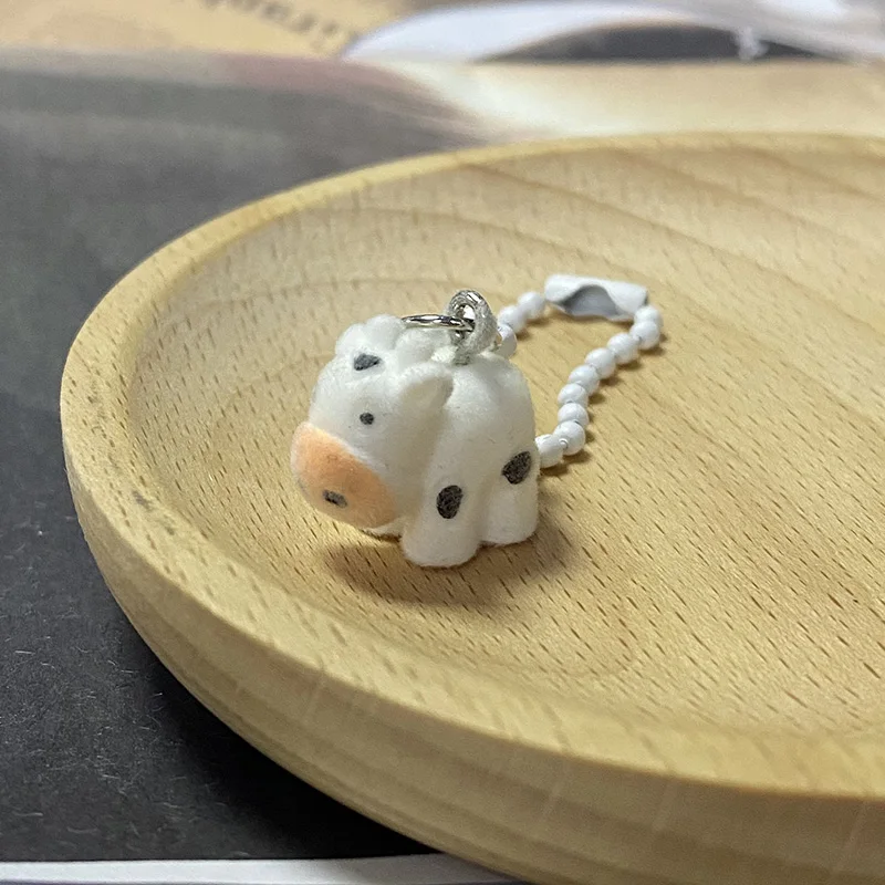 Brelok 3D zwierzęta z żywicy - krowa, świnka, gąsienica A nai niu lianzi