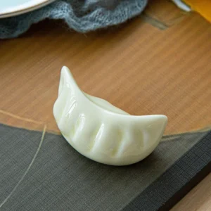 Ceramiczny uchwyt na pałeczki do jedzenia w kształcie kluseczki Czarny