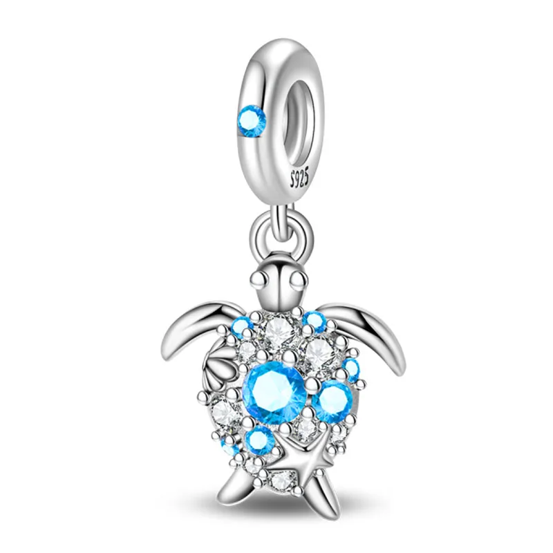 Charms morskie ze srebra 925 – delfin, krab, łódka Neon