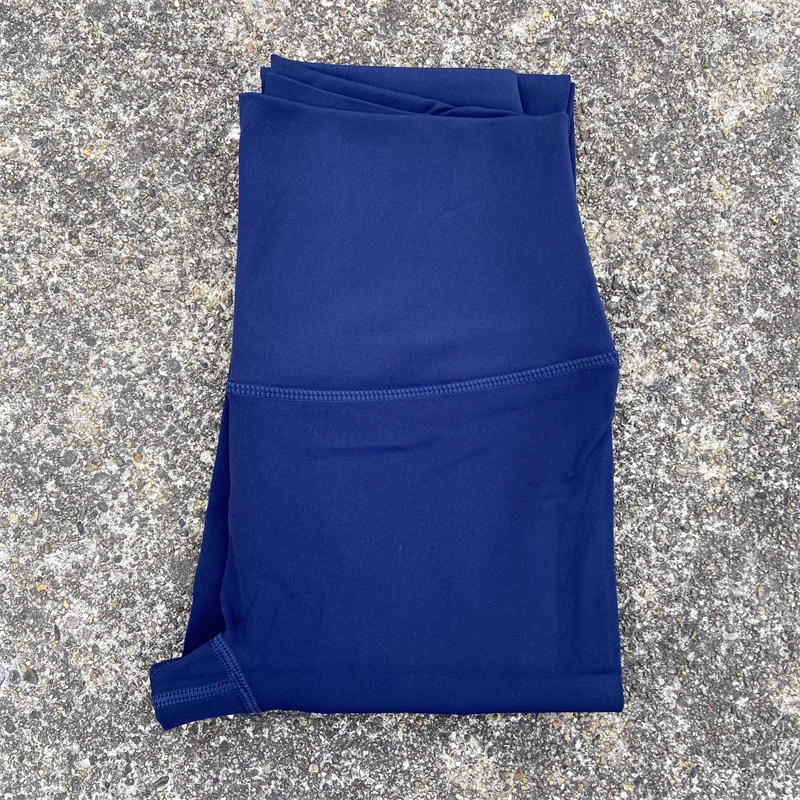Damskie legginsy sportowe z kieszeniami i wysokim stanem Niebieski