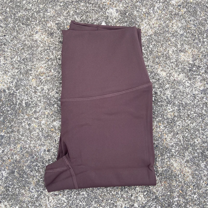 Damskie legginsy sportowe z kieszeniami i wysokim stanem Kawowy