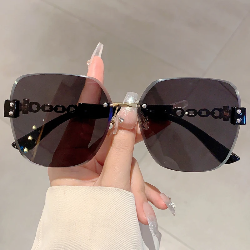 Damskie okulary przeciwsłoneczne oversize bez oprawek 2354c1 blackgrey
