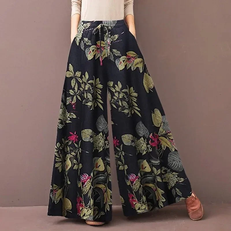 Damskie szerokie spodnie boho w kwiaty z gumką Ciemny niebieski