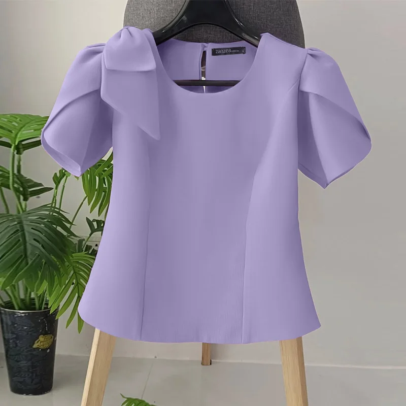 Elegancka bluzka damska z bufiastym rękawem i kokardą Fioletowy