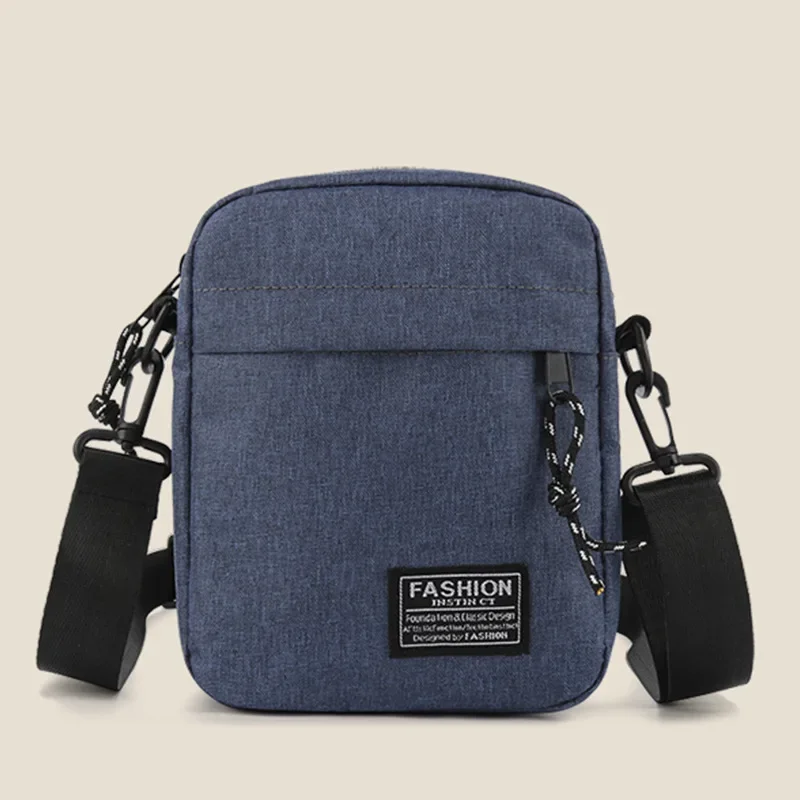 Mała torebka damska crossbody z tkaniny Oxford Niebieski