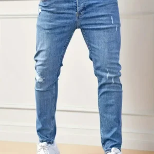 Męskie jeansy slim fit z przetarciami T220