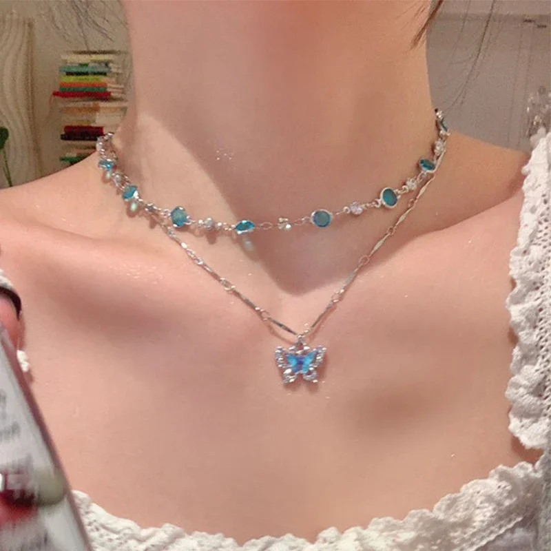 Naszyjnik z niebieskim motylem i cyrkoniami - dwuwarstwowy choker 77579
