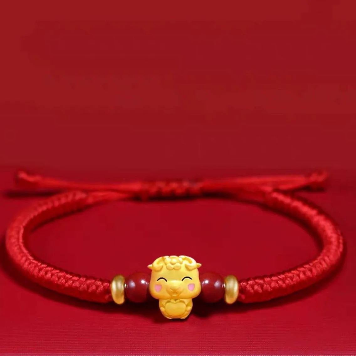 Pleciona bransoletka znak zodiaku – czerwona lina, na szczęście Ciemne złoto