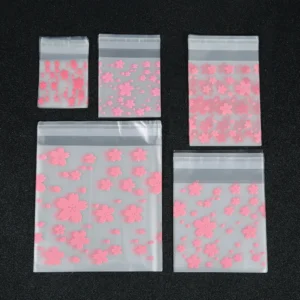 Przezroczyste woreczki strunowe ze wzorem kwiatów sakura — zestaw 100 sztuk Biały