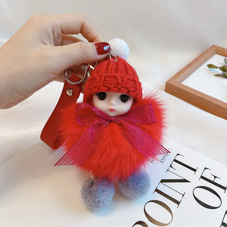 Puszysty brelok śpiąca laleczka pompon do torebki i kluczy Ky 055