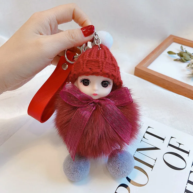 Puszysty brelok śpiąca laleczka pompon do torebki i kluczy Ky 056