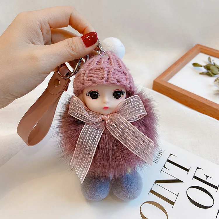 Puszysty brelok śpiąca laleczka pompon do torebki i kluczy Ky 057