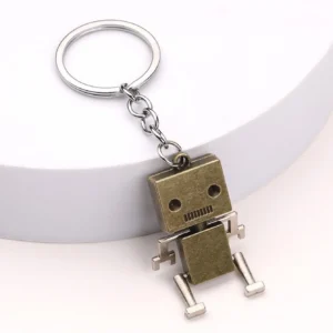 Ruchomy brelok do kluczy z robotem retro żółty