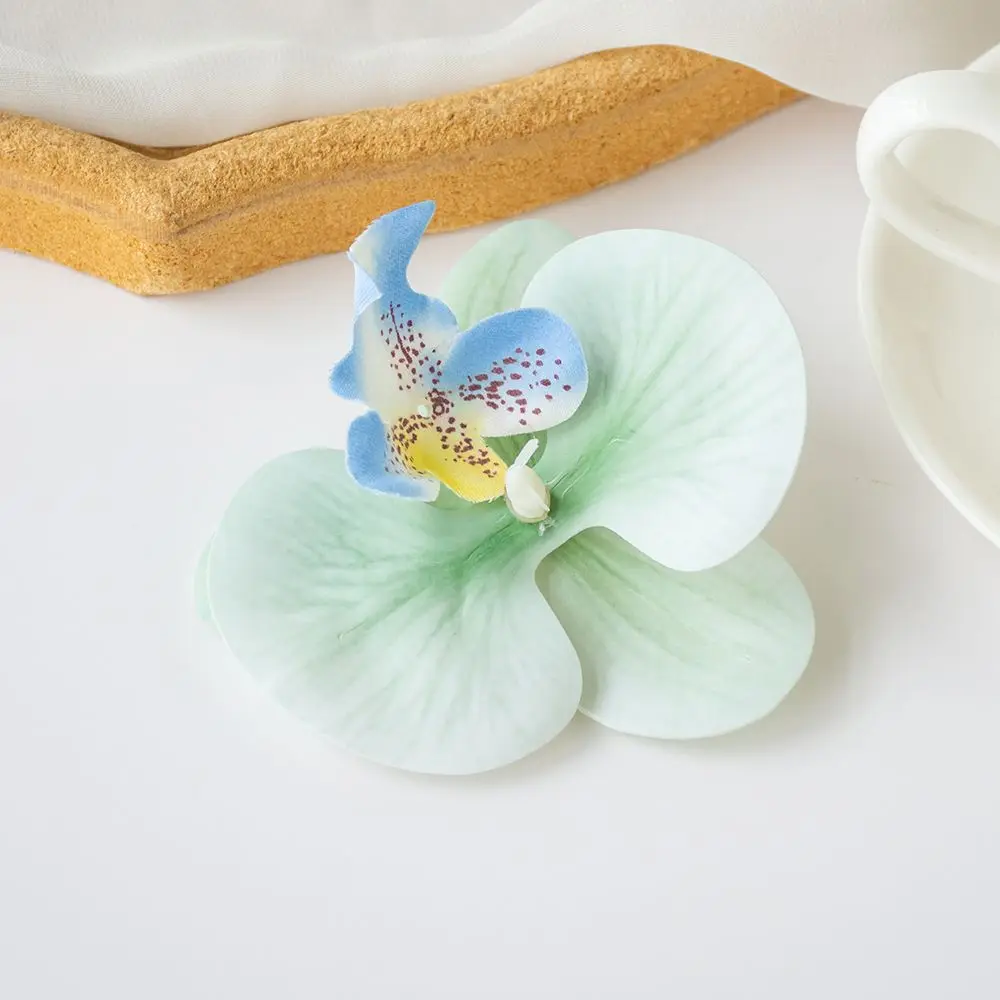 Sztuczna orchidea motylkowa — ozdoba do włosów i dekoracji śliwka