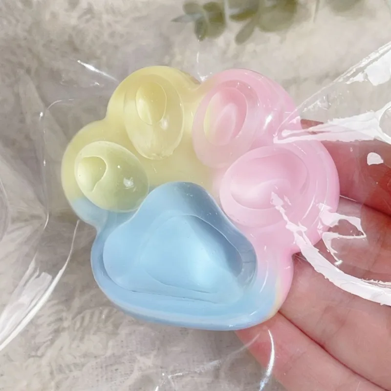 Tęczowa squishy kocia łapka - zabawka antystresowa Jasnoszary