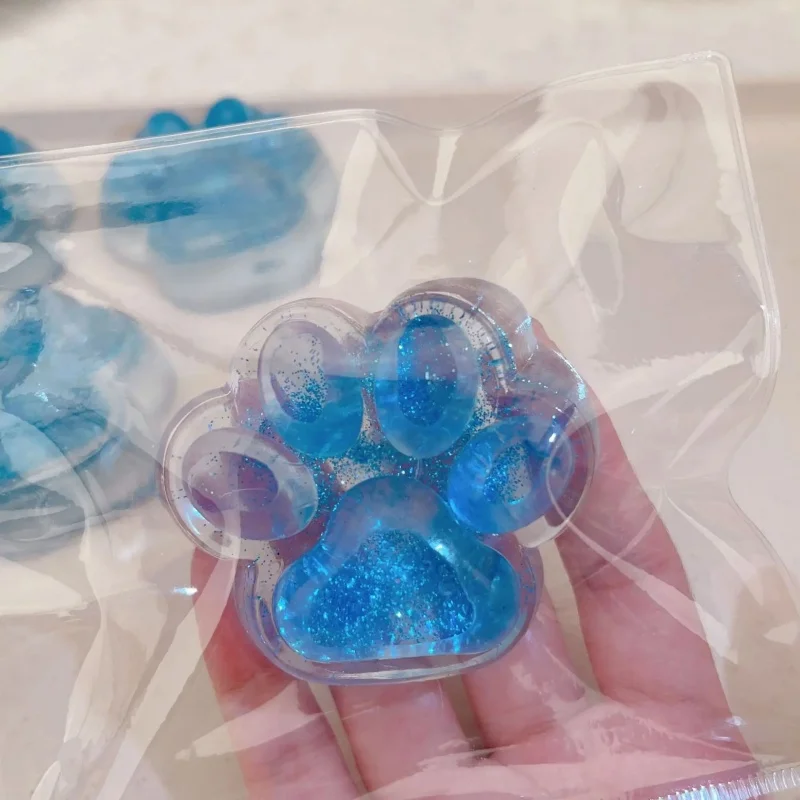 Tęczowa squishy kocia łapka - zabawka antystresowa śliwka