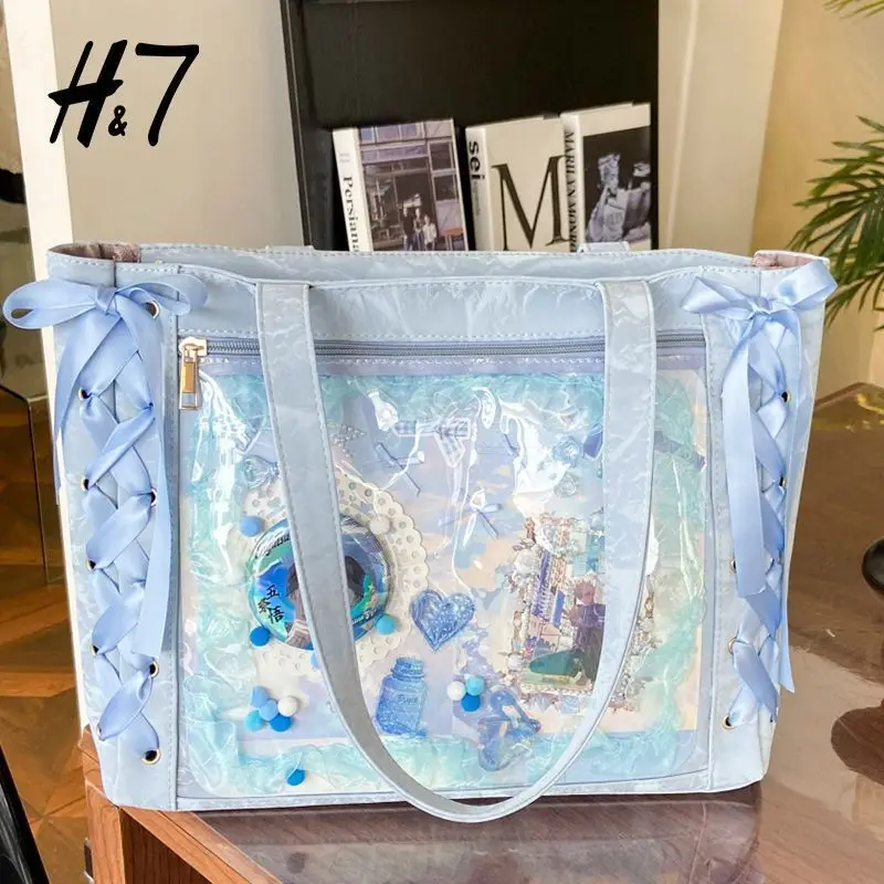 Torba itabag na ramię z dużą wstążką i przezroczystą kieszenią na piny Niebieski